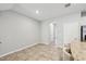 Dining area with tile floor and archway leading to hallway at 6620 Serenity Fall Ln, Sarasota, FL 34240