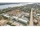 Aerial view of coastal community with ocean and residential areas at 6703 Midnight Pass Rd # 108B, Sarasota, FL 34242