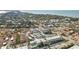 Aerial view of a coastal community showing multiple buildings and a body of water at 6703 Midnight Pass Rd # 108B, Sarasota, FL 34242