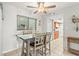Dining area with table and chairs, view to kitchen at 6703 Midnight Pass Rd # 108B, Sarasota, FL 34242