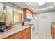 Well-equipped kitchen featuring granite countertops and ample cabinetry at 6703 Midnight Pass Rd # 108B, Sarasota, FL 34242