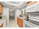 Clean and efficient kitchen with granite countertops and white appliances at 6703 Midnight Pass Rd # 108B, Sarasota, FL 34242