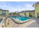 Inviting community pool with lounge chairs and surrounding patio at 6703 Midnight Pass Rd # 108B, Sarasota, FL 34242