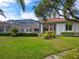Large backyard with a screened patio and beautiful landscaping at 7207 Saint Johns Way, University Park, FL 34201