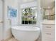 Bathroom features a free-standing tub and large window at 7207 Saint Johns Way, University Park, FL 34201