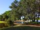 Wooden footbridge over tranquil pond at 7207 Saint Johns Way, University Park, FL 34201
