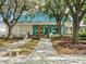 Inviting clubhouse entrance with landscaping and walkway at 7207 Saint Johns Way, University Park, FL 34201