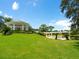 Landscaped area with gazebo and bridge over water at 7207 Saint Johns Way, University Park, FL 34201