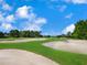 Picturesque golf course with sand traps and lush greens at 7207 Saint Johns Way, University Park, FL 34201