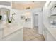 White kitchen with pantry and laundry access at 7207 Saint Johns Way, University Park, FL 34201