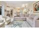Open living space with sectional sofa and a view of the kitchen and dining area at 7207 Saint Johns Way, University Park, FL 34201