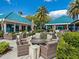 Outdoor patio with fire pit and comfortable wicker furniture at 7207 Saint Johns Way, University Park, FL 34201