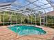 Relaxing pool and spa with a screened enclosure, perfect for outdoor enjoyment at 7207 Saint Johns Way, University Park, FL 34201