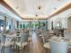 Elegant dining room with modern light fixtures and comfortable seating at 7207 Saint Johns Way, University Park, FL 34201