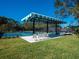 Covered seating area overlooking tennis courts at 7207 Saint Johns Way, University Park, FL 34201