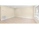 Spacious bedroom with light walls and vinyl plank flooring at 727 N Jefferson Ave # 727, Sarasota, FL 34237