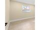 Bright bedroom with large window and light neutral walls at 727 N Jefferson Ave # 727, Sarasota, FL 34237