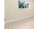Simple bedroom with large window and light colored walls at 727 N Jefferson Ave # 727, Sarasota, FL 34237