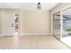 Light and bright dining area with wood floor and access to the patio at 727 N Jefferson Ave # 727, Sarasota, FL 34237