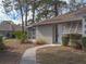 Tan house exterior with walkway, landscaping, and neighboring house visible at 727 N Jefferson Ave # 727, Sarasota, FL 34237
