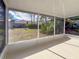 Screened-in porch with view of backyard and trees at 727 N Jefferson Ave # 727, Sarasota, FL 34237