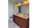 Double vanity bathroom with large mirror and tile flooring at 732 Tuxford Dr, Sarasota, FL 34232