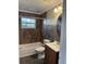 Bathroom with shower/tub combo, toilet and vanity at 732 Tuxford Dr, Sarasota, FL 34232