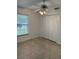 Bright bedroom with tiled floors and double doors at 732 Tuxford Dr, Sarasota, FL 34232