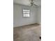 Simple bedroom with tile flooring and ceiling fan at 732 Tuxford Dr, Sarasota, FL 34232