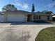 Single story home with attached garage and driveway at 732 Tuxford Dr, Sarasota, FL 34232