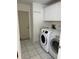 Laundry room with washer, dryer and exterior access at 732 Tuxford Dr, Sarasota, FL 34232