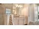 Bathroom featuring a vanity, shower, and linen at 7668 Registrar Way, Sarasota, FL 34243