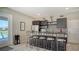 Well-equipped community kitchen with bar seating at 7668 Registrar Way, Sarasota, FL 34243