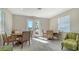 Bright community room with tables and chairs at 7668 Registrar Way, Sarasota, FL 34243