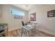 Home office with glass desk and hardwood floors at 7668 Registrar Way, Sarasota, FL 34243