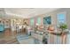 Spacious living room with comfortable seating and views into the kitchen at 7668 Registrar Way, Sarasota, FL 34243