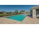 Community pool with patio and seating areas at 7668 Registrar Way, Sarasota, FL 34243