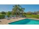 Community pool with lounge chairs at 7668 Registrar Way, Sarasota, FL 34243