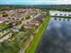 Aerial view of a beautiful community with lake access and lush landscaping at 7708 31St E St, Sarasota, FL 34243