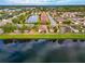 Aerial view of community with lake and homes at 7708 31St E St, Sarasota, FL 34243