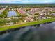 Wide aerial view of neighborhood with lake at 7708 31St E St, Sarasota, FL 34243