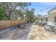 Spacious backyard with gravel area, fire pit, and seating at 8204 Constance Dr, Sarasota, FL 34243