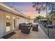Backyard patio with seating, fire pit, and string lights at 8204 Constance Dr, Sarasota, FL 34243