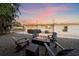 Relaxing backyard with fire pit and seating area, perfect for outdoor gatherings at 8204 Constance Dr, Sarasota, FL 34243