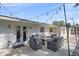 Relaxing backyard patio with seating area, fire pit, and string lights at 8204 Constance Dr, Sarasota, FL 34243