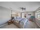 Spacious bedroom with ceiling fan and view into another room at 8204 Constance Dr, Sarasota, FL 34243