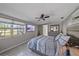 Bedroom with large TV, ceiling fan, and view from window at 8204 Constance Dr, Sarasota, FL 34243