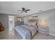 Main bedroom with ensuite bathroom access, large bed, and dresser at 8204 Constance Dr, Sarasota, FL 34243