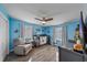 Bedroom with crib, ceiling fan, and nautical theme at 8204 Constance Dr, Sarasota, FL 34243