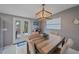 Dining area with wood table and chairs, access to backyard at 8204 Constance Dr, Sarasota, FL 34243
